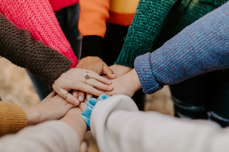 A support worker and client sharing a warm moment together outdoors